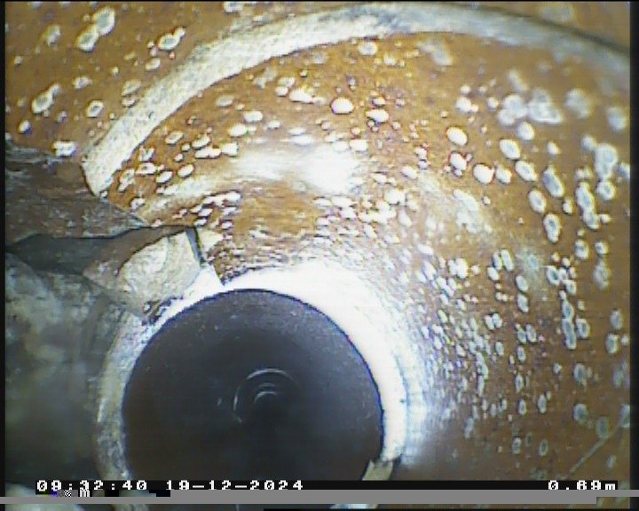 CCTV still showing a cracked and displaced drain pipe section in Bristol