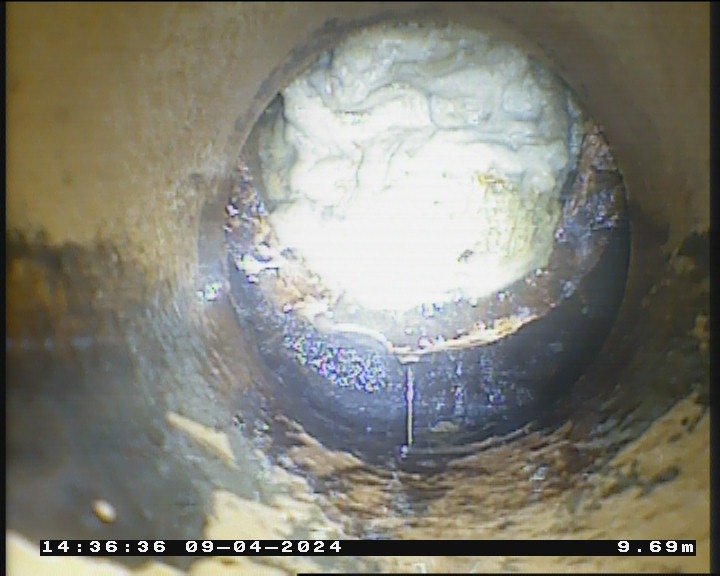 CCTV still showing fat and grease build-up narrowing a drain in Bristol