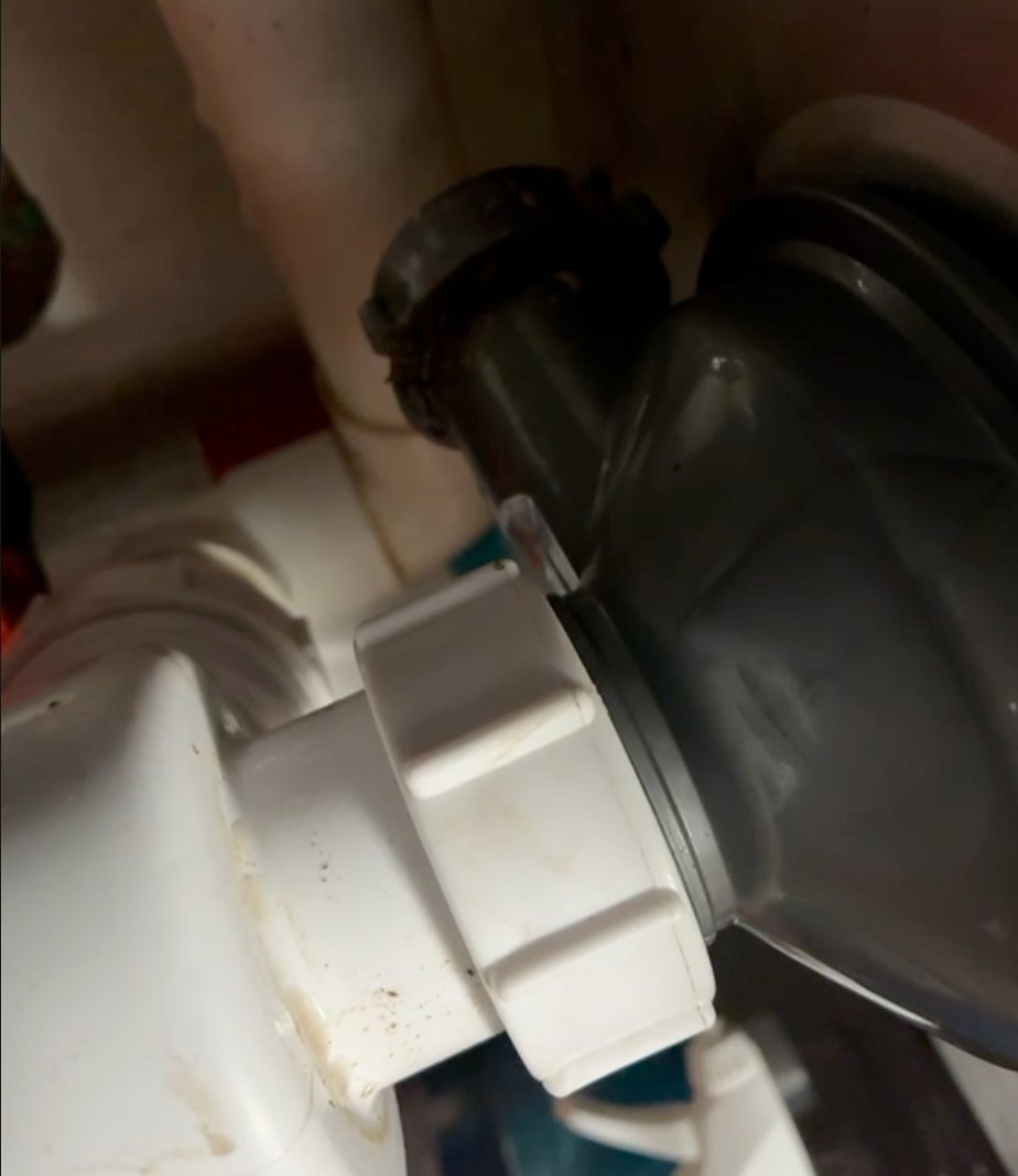 Flow Sure Drains engineer clearing a blocked sink trap in a Bristol kitchen