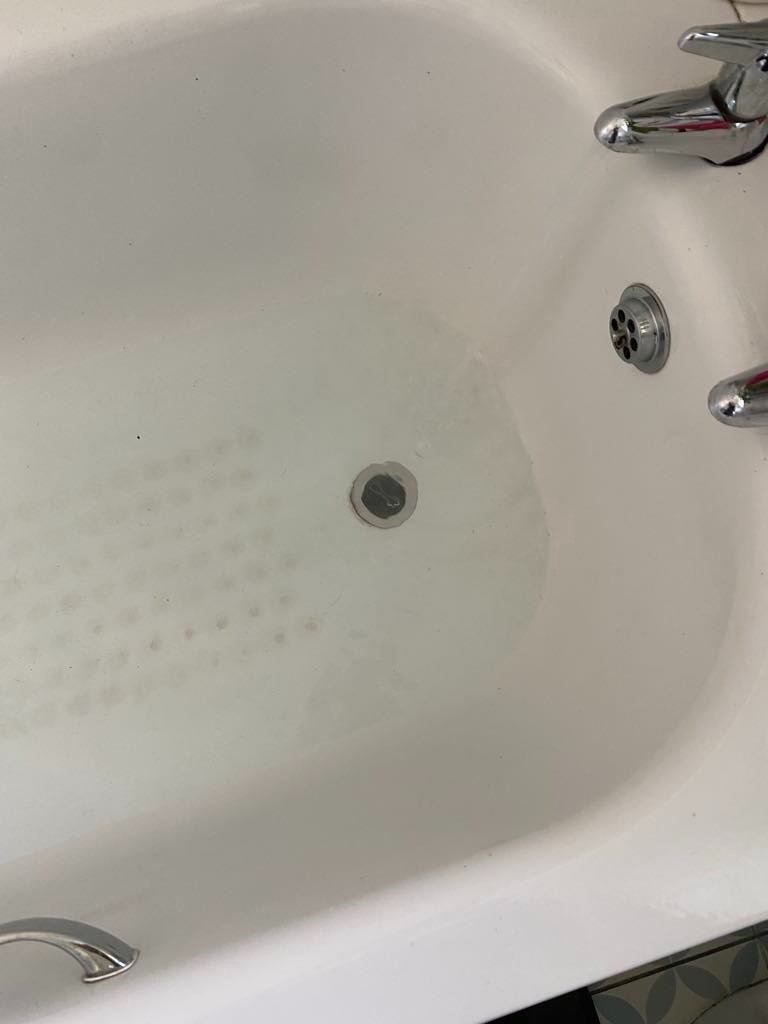Flow Sure Drains engineer clearing a blocked toilet in a Bristol bathroom