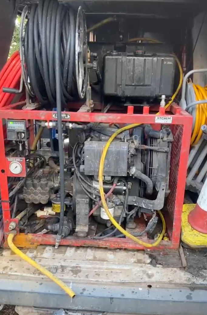 Flow Sure Drains high-pressure jetting unit in use on a Bristol drain