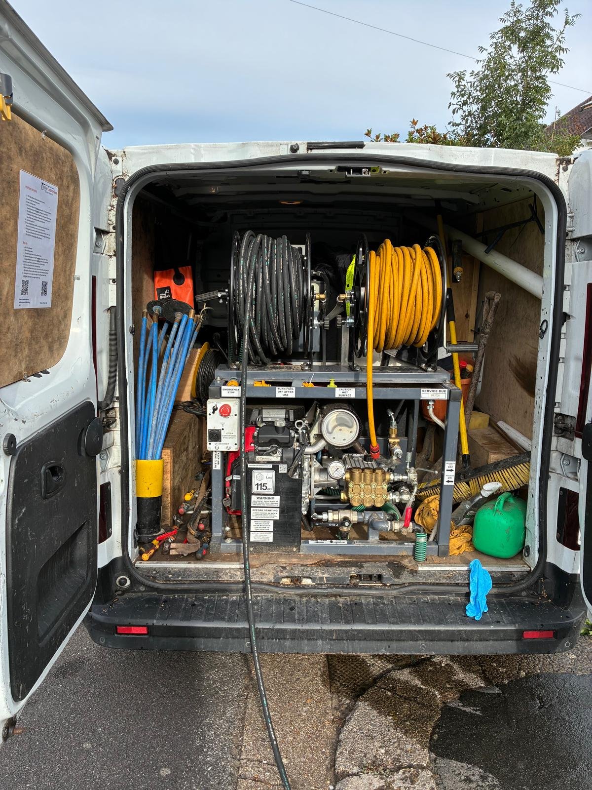Flow Sure Drains jetting equipment and camera reel loaded in the company van